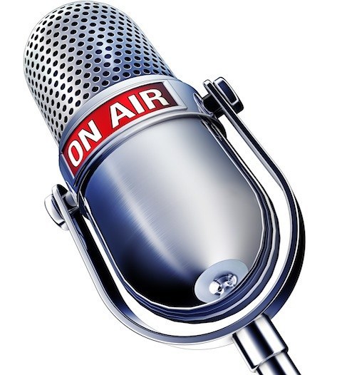 Image of a microphone with the words on air on it.