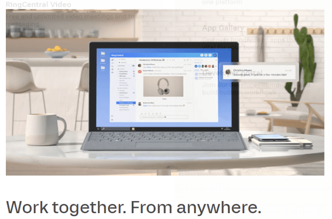 Screenshot of a RingCentral website page with an image of a laptop on a table and a headline beneath the image that says, "Work together. From anywhere."