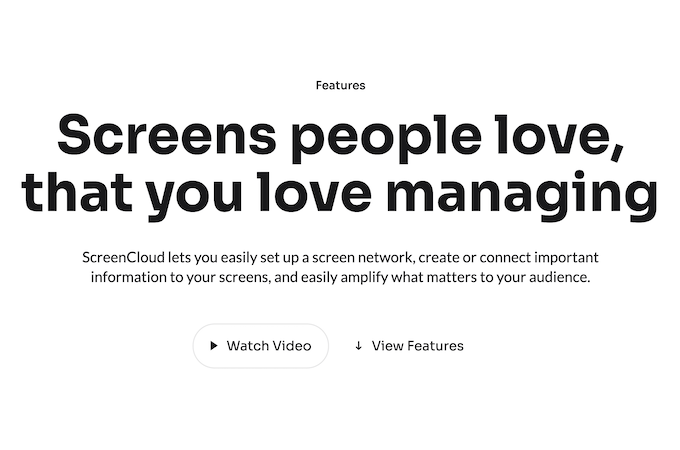A header with black lettering against a white background that reads “Screens people love, that you love managing.” Below is smaller text and two buttons with options to watch a video or view ScreenCloud’s features.