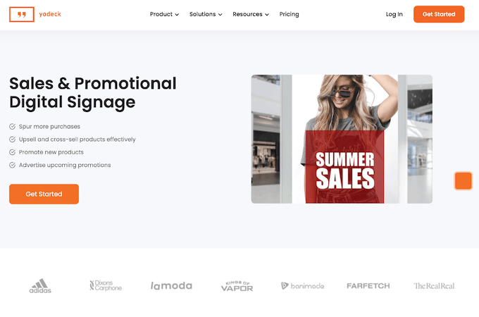 Text on the left against a gray background that reads “Sales & Promotional Digital Signage” with features listed beneath it. On the right is an image of a person with long hair looking down and wearing a t-shirt and sunglasses. In front of them is a red sign that says “Summer Sales.