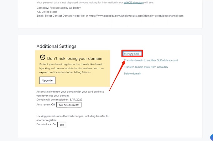 A screenshot of the additional setting screen in a GoDaddy account with a red arrow pointing to the manage DNS feature.