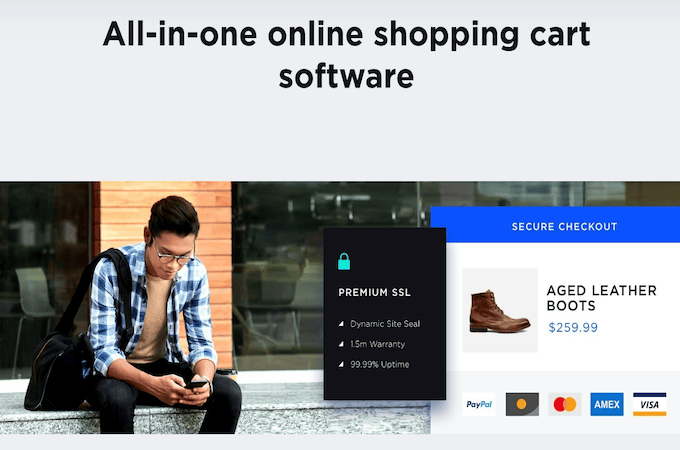 A screenshot of BigCommerce’s shopping cart features landing page showing a person shopping on their phone.