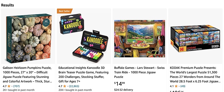 Amazon search results for puzzles with four products displayed. 