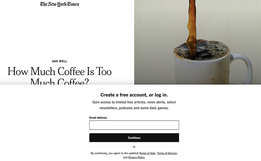 The New York Times site with the popup to create a free account or log in. 